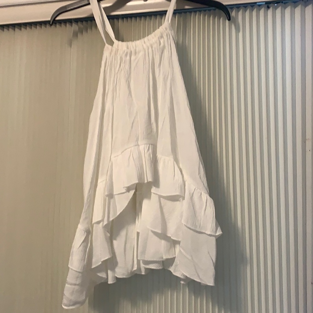 Flowy white blouse. High front and longer back. No brand. Never worn but no tags